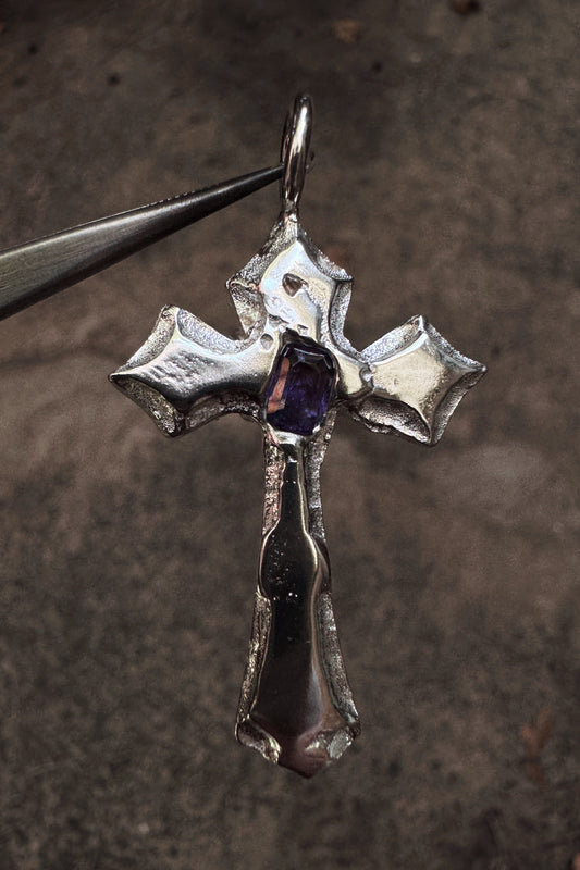 melted cross pendant