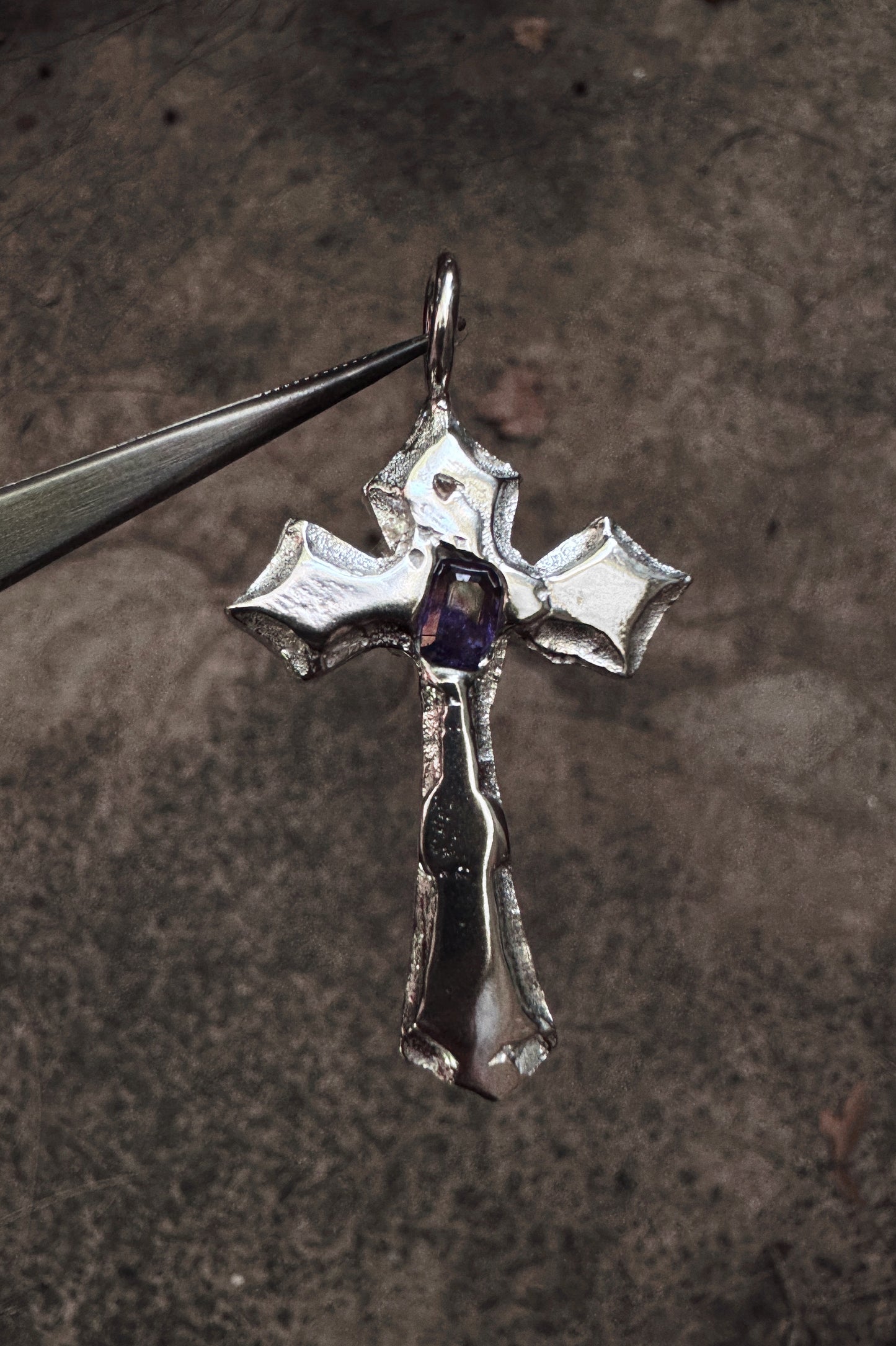 melted cross pendant