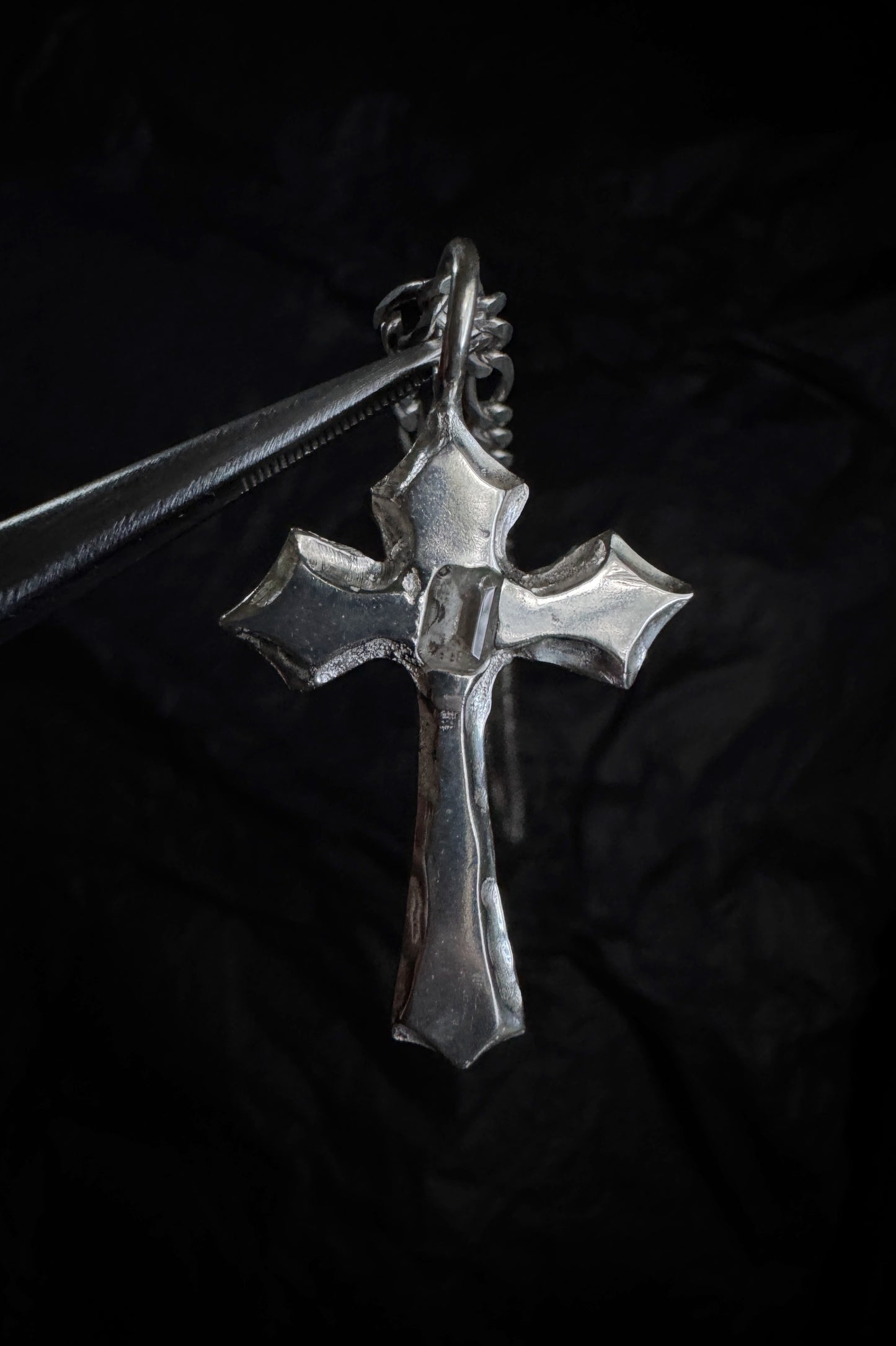 melted cross pendant
